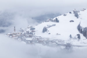 the villages of candid and casamazzagno emerging from the winter mists, dolomites, comelico superiore, belluno, veneto, italy, europe the villages of candid and casamazzagno emerging from the winter mists, dolomites, comelico superiore, belluno, veneto, italy, europe