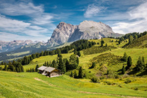 traditional mountain huts in the pastures of the alpe di siusi, with the Sassopiatto / Plattkofel in the background, province of bolzano, South Tyrol / Südtirol, Italy, Europe traditional mountain huts in the pastures of the alpe di siusi, with the Sassopiatto / Plattkofel in the background, province of bolzano, South Tyrol / Südtirol, Italy, Europe