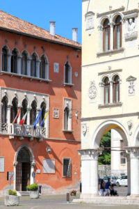 Italy, Veneto, Belluno, Dolomites, the facade of Palazzo Rosso seat of the town hall of Belluno and the yellow facade of Palazzo dei Rettori seat of the Prefecture Italy, Veneto, Belluno, Dolomites, the facade of Palazzo Rosso seat of the town hall of Belluno and the yellow facade of Palazzo dei Rettori seat of the Prefecture