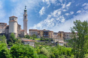 Italy, Veneto, Belluno, Dolomites, the view of the city with the bell tower of the Basilica of San Martino Italy, Veneto, Belluno, Dolomites, the view of the city with the bell tower of the Basilica of San Martino