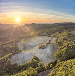 Aerial view of the Cesane natural area, landscape at sunset, near Urbino, Marche region, central Italy