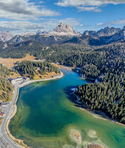 Aerial view of Lake Misurina with the Cadini di Misurina and Tre Cime di Lavaredo mountain groups in the background, near Auronzo di Cadore, Belluno province, Veneto region, northeastern Italy