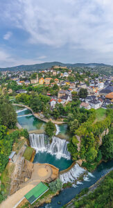 Aerial view of the Pliva waterfall with the historic town of Jajce, Central Bosnia Canton, Bosnia and Herzegovina Aerial view of the Pliva waterfall with the historic town of Jajce, Central Bosnia Canton, Bosnia and Herzegovina