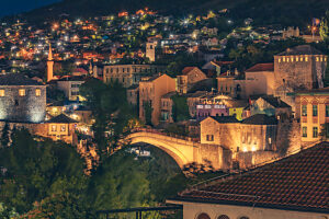 Night view of the Old Bridge (Stari Most) in Mostar, beautifully illuminated with the city lights around, Mostar, Herzegovina-Neretva Canton, Bosnia and Herzegovina Night view of the Old Bridge (Stari Most) in Mostar, beautifully illuminated with the city lights around, Mostar, Herzegovina-Neretva Canton, Bosnia and Herzegovina