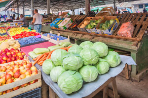 A vibrant farmers market filled with fresh fruits and vegetables under a covered structure, showcasing local produce and daily life. Travnik, Central Bosnia, Bosnia and Herzegovina A vibrant farmers market filled with fresh fruits and vegetables under a covered structure, showcasing local produce and daily life. Travnik, Central Bosnia, Bosnia and Herzegovina