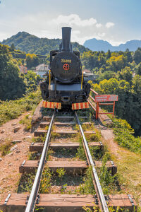 Historic steam locomotive on display in Jablanica, Herzegovina-Neretva Canton, Bosnia and Herzegovina, near the former railway bridge site of the Neretva Valley Historic steam locomotive on display in Jablanica, Herzegovina-Neretva Canton, Bosnia and Herzegovina, near the former railway bridge site of the Neretva Valley