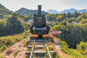 Historic steam locomotive on display in Jablanica, Herzegovina-Neretva Canton, Bosnia and Herzegovina, near the former railway bridge site of the Neretva Valley Historic steam locomotive on display in Jablanica, Herzegovina-Neretva Canton, Bosnia and Herzegovina, near the former railway bridge site of the Neretva Valley