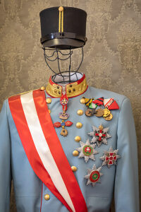 Detail of Archduke Franz FerdinandÃs Austro-Hungarian military uniform, displayed in the Memorial Corner inside Sarajevo City Hall (Vijecnica), dedicated to the events of the Sarajevo assassination in 1914. Sarajevo, Bosnia and Herzegovina Detail of Archduke Franz FerdinandÃs Austro-Hungarian military uniform, displayed in the Memorial Corner inside Sarajevo City Hall (Vijecnica), dedicated to the events of the Sarajevo assassination in 1914. Sarajevo, Bosnia and Herzegovina