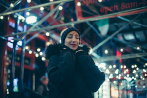 blonde short hair girl on times square on a winter night blonde short hair girl on times square on a winter night