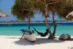 Indonesia, Lombok, Gili Meno, man in his hammock Indonesia, Lombok, Gili Meno, man in his hammock