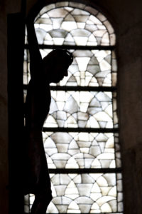 Silhouette of a cross in the Speyer Cathedral Silhouette of a cross in the Speyer Cathedral