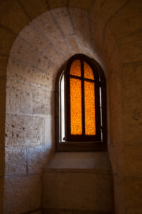 open orange glass window with crossbars, light falls in, Israel, Nazareth, Annunciation church, Annunciation basilica open orange glass window with crossbars, light falls in, Israel, Nazareth, Annunciation church, Annunciation basilica