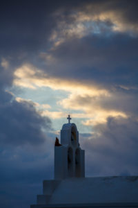 cloud movements with evening light in front of the cross of a chapel, Thira, Greece, Santorini, Santorini cloud movements with evening light in front of the cross of a chapel, Thira, Greece, Santorini, Santorini