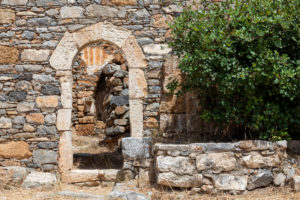 View on archway of a ruined house on Spinalonga, former leprosy island, Greece, Crete, Kalydon View on archway of a ruined house on Spinalonga, former leprosy island, Greece, Crete, Kalydon