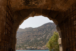 View through the entrance gate from Spinalonga, (former leprosy island) to the Cretan mainland, Greece, Crete, Kalydon View through the entrance gate from Spinalonga, (former leprosy island) to the Cretan mainland, Greece, Crete, Kalydon