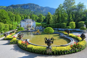 Basin with golden sculpture group in the garden ground floor in front of castle Linderhof, parish of Ettal, Ammertal, Ammergauer alps, Upper Bavaria, Bavaria, Germany Basin with golden sculpture group in the garden ground floor in front of castle Linderhof, parish of Ettal, Ammertal, Ammergauer alps, Upper Bavaria, Bavaria, Germany