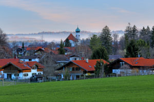 View of Eschenlohe in early spring with morning fog, Loisachtal, Upper Bavaria, Bavaria, Germany View of Eschenlohe in early spring with morning fog, Loisachtal, Upper Bavaria, Bavaria, Germany