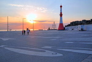 Willy-Brandt-square at the Weser with lighthouse Minarett at sunset, Bremerhaven, mouth of the Weser, Land Bremen, Northern Germany, Germany Willy-Brandt-square at the Weser with lighthouse Minarett at sunset, Bremerhaven, mouth of the Weser, Land Bremen, Northern Germany, Germany