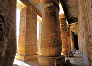 Column hall with reliefs and original colours in the second courtyard in the death temple of Ramses III Medinet Habu in Thebes-West, Luxor, Upper Egypt, Egypt Column hall with reliefs and original colours in the second courtyard in the death temple of Ramses III Medinet Habu in Thebes-West, Luxor, Upper Egypt, Egypt