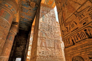 Column hall with reliefs and original colours in the second courtyard in the death temple of Ramses III Medinet Habu in Thebes-West, Luxor, Upper Egypt, Egypt Column hall with reliefs and original colours in the second courtyard in the death temple of Ramses III Medinet Habu in Thebes-West, Luxor, Upper Egypt, Egypt