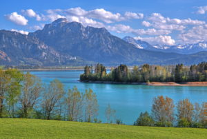 Spring landscape at Forggensee against Säuling (2047m) of the Ammergau Alps, Halblech, Romantic Road, Ostallgäu, Allgäu, Swabia, Bavaria, Germany Spring landscape at Forggensee against Säuling (2047m) of the Ammergau Alps, Halblech, Romantic Road, Ostallgäu, Allgäu, Swabia, Bavaria, Germany