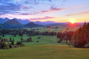 Spring landscape against Tannheim mountains at sunset, Hohenschwangau, Romantic Road, Ostallgäu, Allgäu, Swabia, Bavaria, Germany Spring landscape against Tannheim mountains at sunset, Hohenschwangau, Romantic Road, Ostallgäu, Allgäu, Swabia, Bavaria, Germany