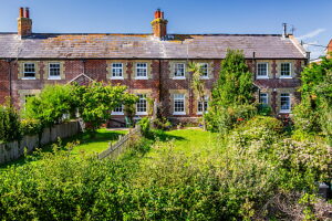Typical terraced house with garden on Freshwater Bay, Freshwater, Isle of Wight, Hampshire, United Kingdom, England