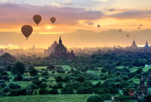 Hot air balloons over the ruin field with stupas and Sulamanite temple in the 'Plain of 2000 Pagodas', Bagan Historical Royal City, Myanmar, Sunset Hot air balloons over the ruin field with stupas and Sulamanite temple in the 'Plain of 2000 Pagodas', Bagan Historical Royal City, Myanmar, Sunset