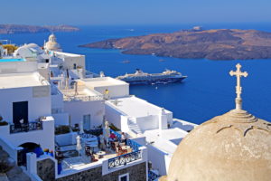 Village on the hillside above the caldera with cruise ship, Fira, Santorini, (Thira), Cyclades, Aegean Islands, Aegean Sea, Greece Village on the hillside above the caldera with cruise ship, Fira, Santorini, (Thira), Cyclades, Aegean Islands, Aegean Sea, Greece