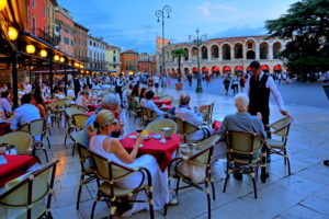 Piazza Bra with street cafes and the Arena, Verona, Veneto, northern Italy, Italy, dusk