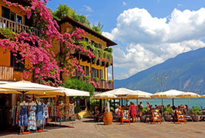 Restaurant terrace on the lakeshore in the center, Limone sul Garda, Lake Garda, Lombardy, Northern Italy, Italy