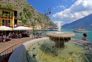 Restaurant terrace on the lakeshore with fountain, Limone sul Garda, Lake Garda, Lombardy, Northern Italy, Italy Restaurant terrace on the lakeshore with fountain, Limone sul Garda, Lake Garda, Lombardy, Northern Italy, Italy