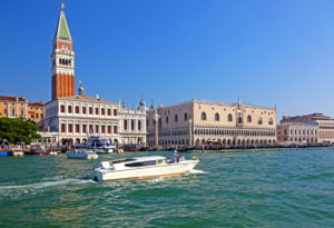 Waterfront with water taxi, Campanile and Doge's Palace, Venice, Veneto, Italy, UNESCO World Heritage Site