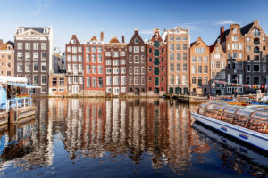 Houses on Damrak in Amsterdam, the Netherlands Houses on Damrak in Amsterdam, the Netherlands