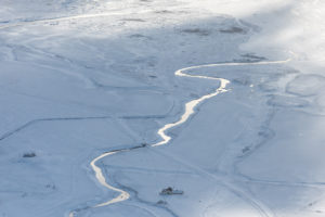 Iceland, bird's-eye view, farm on a river in the winter Iceland, bird's-eye view, farm on a river in the winter