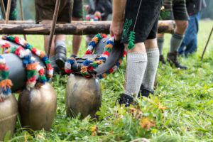 Viehscheid' after Almabtrieb (ceremonial driving down of cattle from the mountain pastures into the valley in autumn) in late summer in Bavaria, farmer in Lederhose sorts the cowbells Viehscheid' after Almabtrieb (ceremonial driving down of cattle from the mountain pastures into the valley in autumn) in late summer in Bavaria, farmer in Lederhose sorts the cowbells