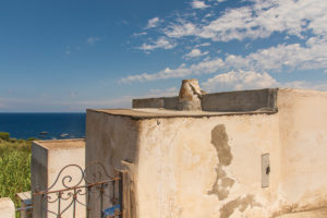 Sicily - Sunny impressions of the Aeolian Islands, also known as Aeolian Islands or Isole Eolie: Lipari, Stromboli, Salina, Vulcano, Panarea, Filicudi and Alicudi. Facade of houses in Panarea. Sicily - Sunny impressions of the Aeolian Islands, also known as Aeolian Islands or Isole Eolie: Lipari, Stromboli, Salina, Vulcano, Panarea, Filicudi and Alicudi. Facade of houses in Panarea.