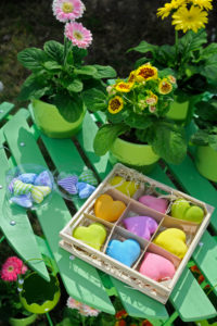 spring decoration with flowerpots and coloured hearts, close-up spring decoration with flowerpots and coloured hearts, close-up