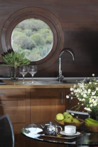 Kitchen with porthole windows in a climate-friendly house in the south Kitchen with porthole windows in a climate-friendly house in the south