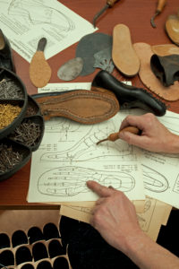 Shoemaker's workshop, drawing for tailor-made shoes, unfinished handcrafted shoe and soles, shoemaker, plan, foot, anatomy Shoemaker's workshop, drawing for tailor-made shoes, unfinished handcrafted shoe and soles, shoemaker, plan, foot, anatomy