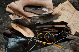 Shoemaker's workshop, accessories to make a handcrafted shoe, still life Shoemaker's workshop, accessories to make a handcrafted shoe, still life