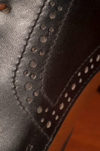 Handmade leather shoe, seam, detail, close-up Handmade leather shoe, seam, detail, close-up
