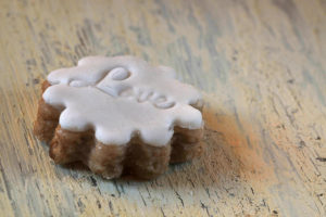 Cookies with fondant coating, shabby chic background Cookies with fondant coating, shabby chic background
