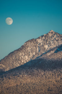 Full moon over snow-covered mountains, Mittenwald, Werdenfelser Land, district Garmisch-Partenkirchen, Bavaria, Germany Full moon over snow-covered mountains, Mittenwald, Werdenfelser Land, district Garmisch-Partenkirchen, Bavaria, Germany