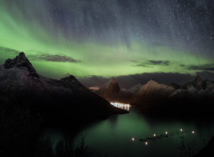Northern lights over Fjordgård on Senja Island in Norway at night Northern lights over Fjordgård on Senja Island in Norway at night