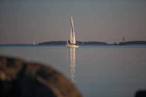 Yacht between the archipelago near Turku, Finland in sunset Yacht between the archipelago near Turku, Finland in sunset