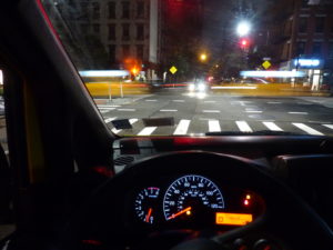 NYC, view of Upper Westside intersection with passing yellow cabs viewed threw the windshield NYC, view of Upper Westside intersection with passing yellow cabs viewed threw the windshield