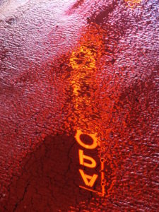 Water reflection in a puddle, Apollo Theater neon sign Water reflection in a puddle, Apollo Theater neon sign