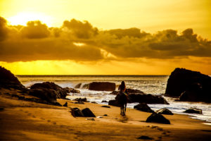 South America, Brazil, Fernando de Korona, island, rider in sunset South America, Brazil, Fernando de Korona, island, rider in sunset