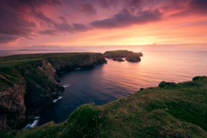 red sunset at the cliffs of Benwee Head, County Mayo, Ireland